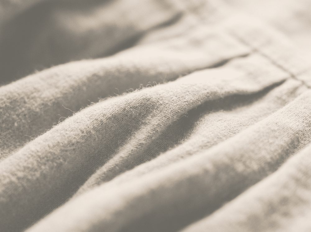 Duotone photograph of soft folded textile fibres for Huggies